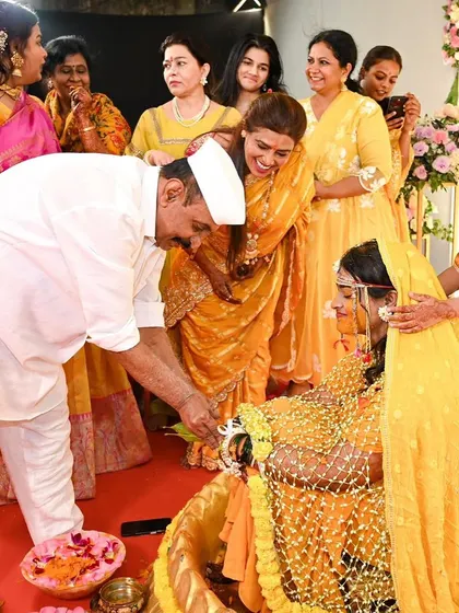 A touching moment between a father and daughter during her Haldi ceremony. She is wearing our fresh floral shela, a piece that adds so much emotion and tradition to the day.