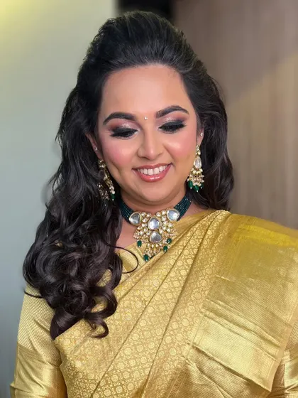 A joyful shot showing off her beautiful smile and glowing makeup. The soft glam enhances her natural beauty perfectly.
