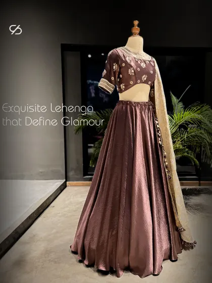 Embrace elegance and grace with my exquisite occasion wear Lehengas. This shimmering brown lehenga with a golden brocade dupatta defines glamour.