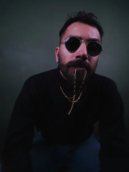 This is my signature look. A moody, close-up portrait that captures the classic, rugged style I bring to men's fashion and accessory photoshoots.