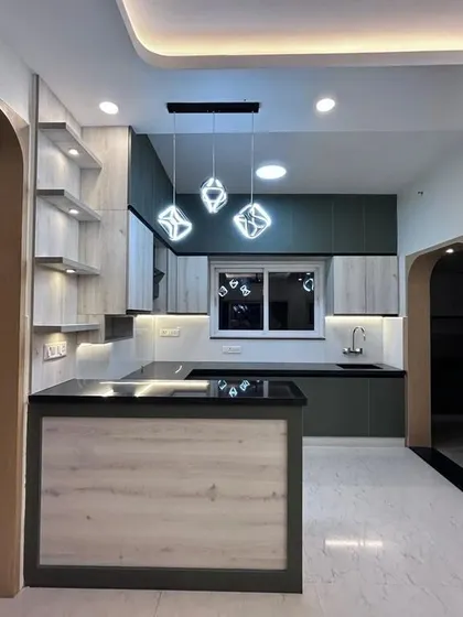 This angle shows the arched entryway leading into the kitchen area, adding a soft architectural element to the space.