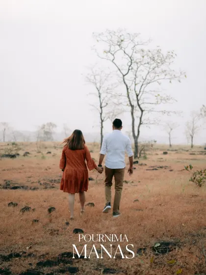 A beautiful shot of the couple walking away into a field, symbolizing their journey forward together.