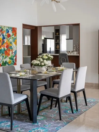 A dining room designed by Aurora Studio, featuring our custom dining table and chairs. The simple, elegant lines of the furniture create a sophisticated space for family meals.