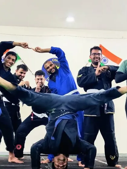 Training while having fun is our motto. This photo captures the camaraderie and playful spirit of our Gi Jiu-Jitsu class, even after intense rounds of rolling.