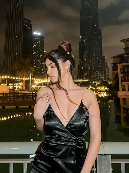 A different pose from the Dubai night shoot, creating a more pensive mood.