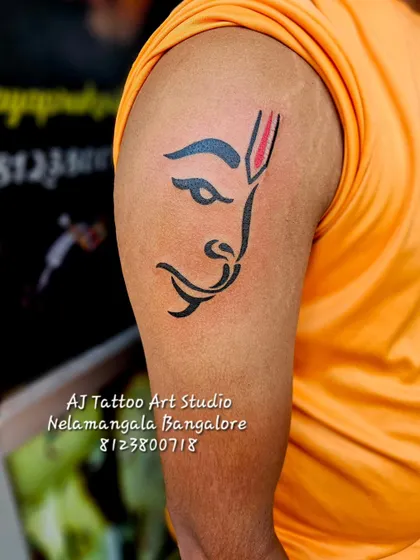 A minimalist yet powerful Hanuman tattoo on the upper arm. This design is simple, clean, and instantly recognizable.