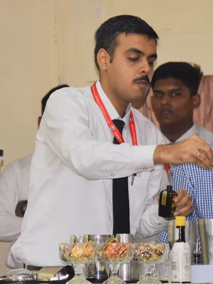 A student gets hands-on guidance during our workshop at SRM IHM. We focus on practical learning, ensuring every participant gets a chance to mix and create.