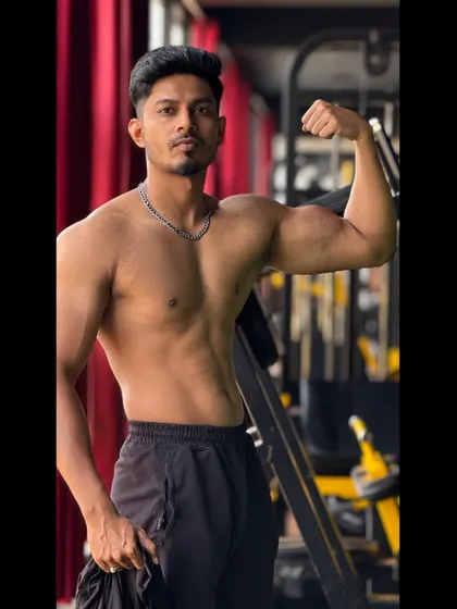 Flexing my bicep in the gym.