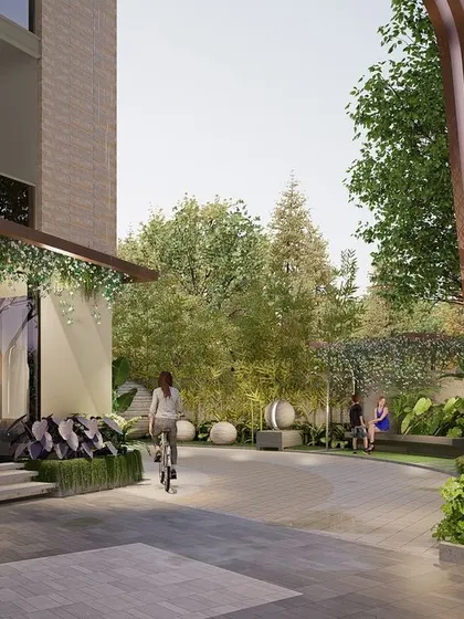 This urban landscape is detailed with sculptural elements to create focal points. The design complements the color tones of the space with well-placed lights, blending softscapes and hardscapes in a soothing fashion.
