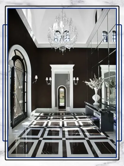 Elevate your lifestyle in this exquisite mansion of dreams. The grand foyer features a stunning crystal chandelier and bold, geometric Italian marble flooring.