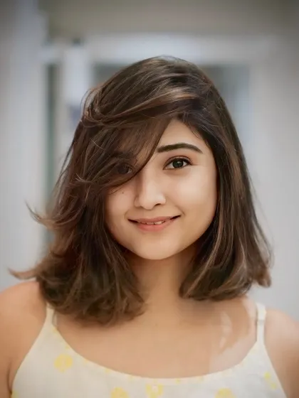Bold, edgy, and bobbed. This medium-length cut features soft layers and a feathered fringe for a relaxed yet stylish vibe.