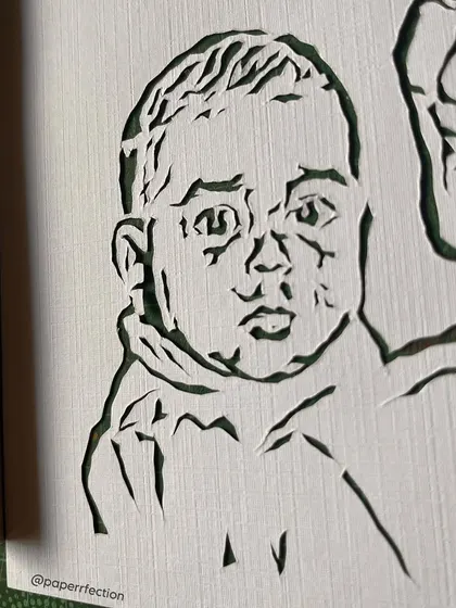 A super close-up look at the intricate details in the portrait for Liza Koshy. Every single line is carefully cut by hand to capture the unique features and expressions from the original photograph.