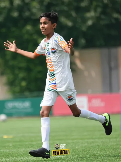 A young player on the run, showcasing the speed and agility we develop through our specialized conditioning programs.