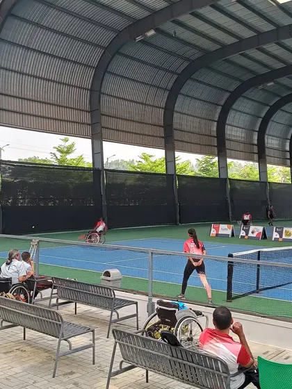 Spectators and players watch a match during the Tabebuia Open. Our facility is designed to be fully accessible and comfortable for athletes and fans alike.