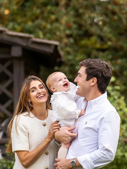 Pure, unscripted laughter. I captured this beautiful family portrait in just a few minutes after their baby's baptism, proving that the best moments are often the most spontaneous.