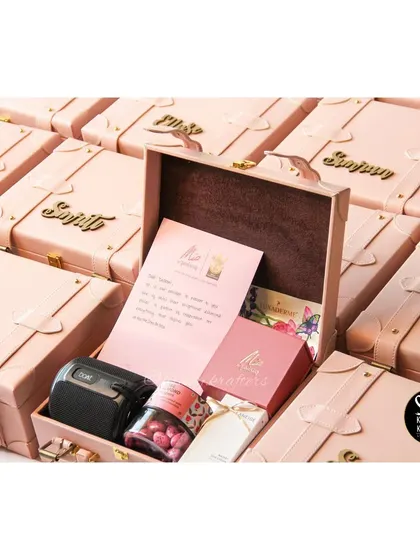 A closer look inside the personalized trunk boxes for the RCB team, which included a Mia by Tanishq gift and a boat speaker.