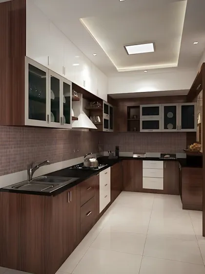 This L-shaped kitchen features a beautiful combination of dark wood and two-tone cabinets. The glass-fronted uppers and sleek black countertop give it a modern and sophisticated feel.