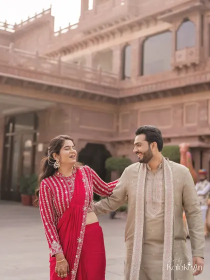 A moment of shared laughter and candid interaction. Even in a grand setting, we focus on capturing the real, unposed connection between the couple.