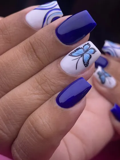 A clearer, still image of the blue butterfly set, highlighting the fine lines and soft shading of the hand-painted wings.