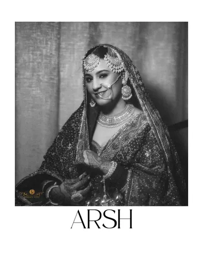 A classic black and white portrait of the bride, Arsh. This timeless shot captures her beautiful smile and the elegance of her complete bridal look.