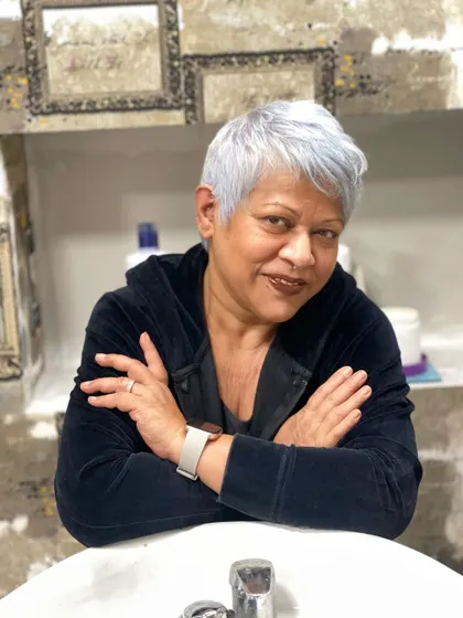 A classic pixie cut meets creative color. This silver-grey look is chic, timeless, and proves that embracing grey can be a powerful style statement.