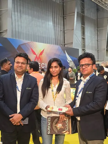 Networking with industry peers and suppliers at a design conference. These connections are vital for sourcing the best materials and partners for my projects.