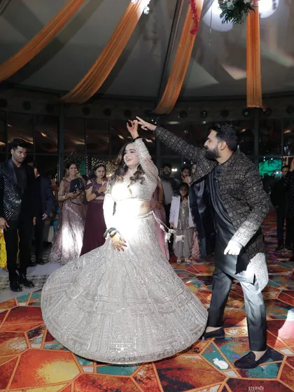 A beautiful twirl on the dance floor. I teach simple techniques that make any couple look graceful and elegant during their first dance, no matter their experience level.