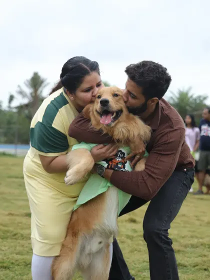 Pure love and cuddles for the birthday boy. This happy Golden Retriever is getting smothered with kisses from his family.