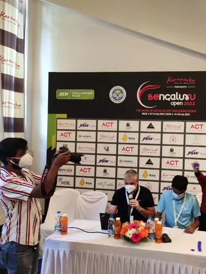 A photographer captures the moment as one of our students helps with the main draw selection at the Bengaluru Open. We ensure our players get to see how professional events are run.