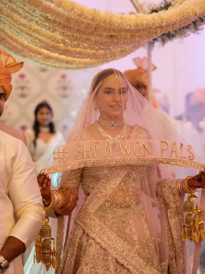 A close-up of the bride's custom veil featuring their wedding hashtag. It's these personal touches that make a wedding truly unique.