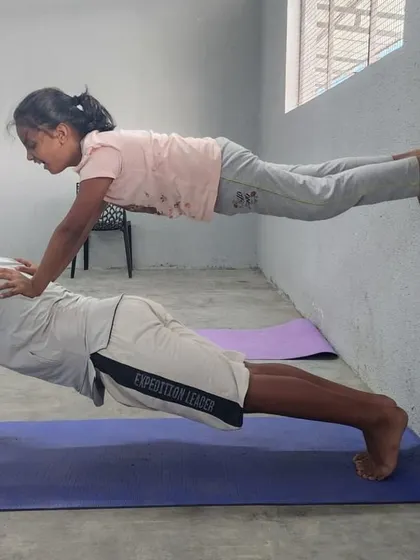 Using a wall for support, these partners work on an elevated plank. This variation increases the challenge and helps build upper body and core strength in a controlled way.