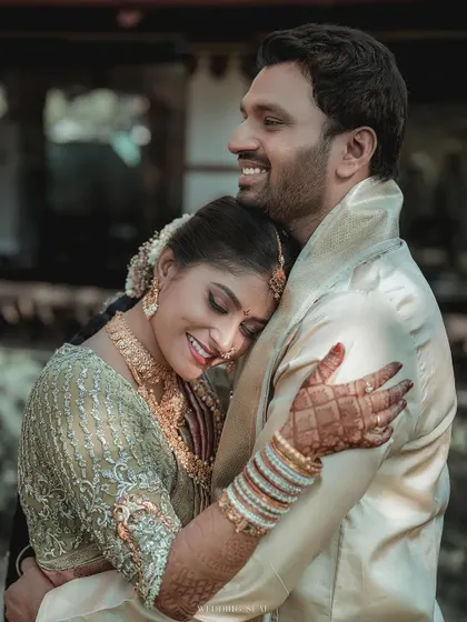 A portrait of pure happiness. The bride's joyful expression as she holds onto her groom is a perfect example of the candid, love-filled moments I aim to capture.
