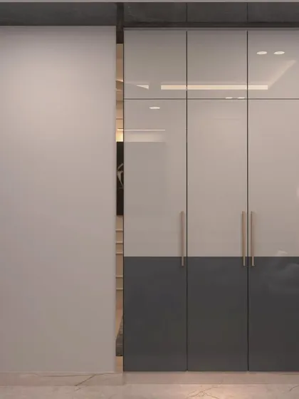 A view of the two-tone wardrobe in the Munirka bedroom render. The combination of glossy white and grey panels with sleek handles is modern and stylish.