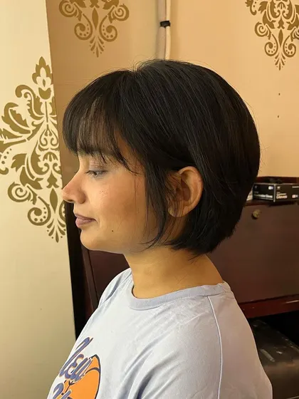 A side view of the razor-cut bob, showing the soft edges.