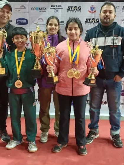 A proud moment for our players and coaches at the Delhi State Table Tennis Championship. Arunim and Akanksha Singhal stand with their coaches, holding multiple trophies from a successful tournament where they won gold in several individual and team events.