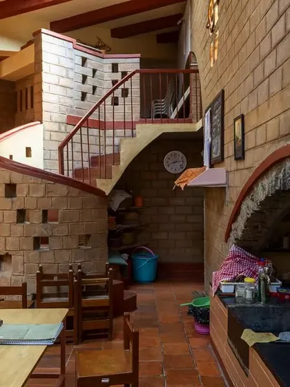 A view of the Promise Center Montessori from the late 90s, showing a child-scaled kitchenette and a spiral staircase. The design thoughtfully considers the perspective and needs of its youngest users.