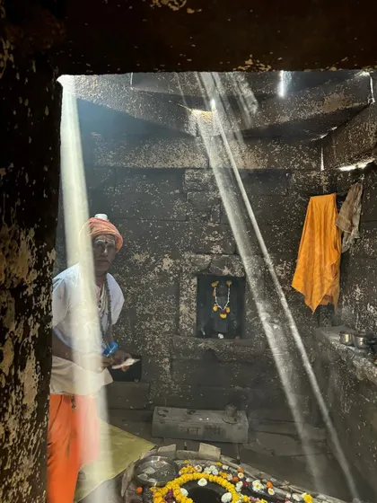 A priest inside the restored Wageshwar Temple, illuminated by a shaft of sunlight. This project was a careful intervention to stabilize the ancient structure while enhancing its spiritual atmosphere through the deliberate manipulation of light.