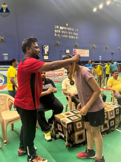 A moment of recognition during the Summer Camp 2024, where a player is awarded a medal for her performance.