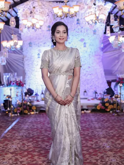 A full-length shot showing the stunning simplicity of the look against a grand backdrop.