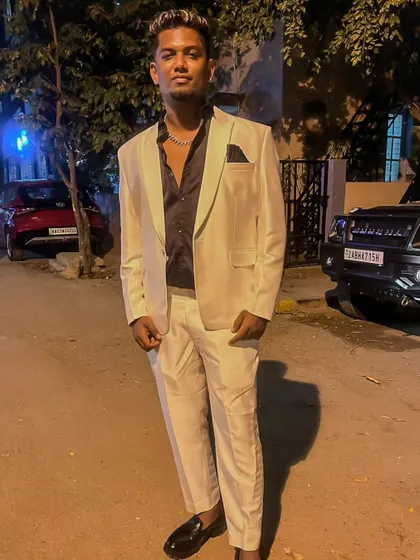 Dressed up in a white suit, ready for a high-end private event. I can adapt my style to match the formality of any occasion, from club nights to corporate gigs.