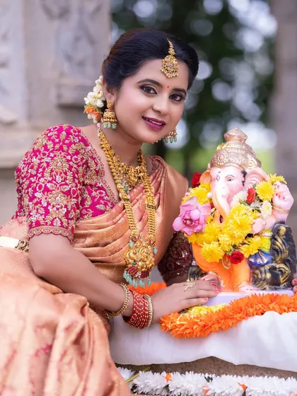 This traditional look, complete with a silk saree and temple jewellery, is perfect for any puja or festive occasion.