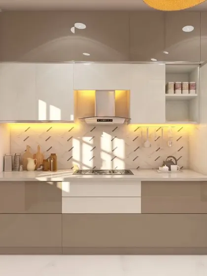 A modern kitchen with two-tone cabinets in glossy beige and white. The patterned backsplash adds a subtle decorative element, while under-cabinet lighting provides excellent task illumination.
