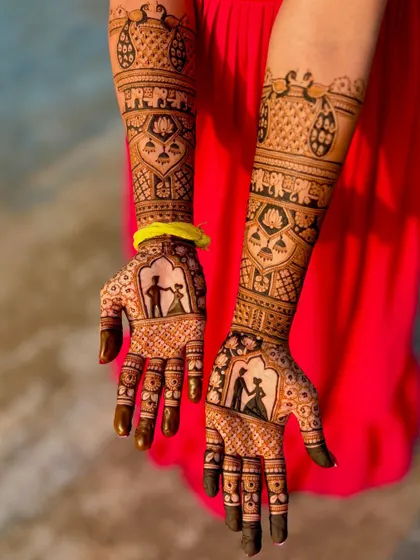 A different angle of the dancing couple silhouette design. This view shows how the story elements on the palm connect seamlessly with the intricate patterns on the arms.