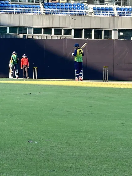 A batsman takes guard during a practice match in a large stadium. Simulating match conditions is crucial for mental preparation.