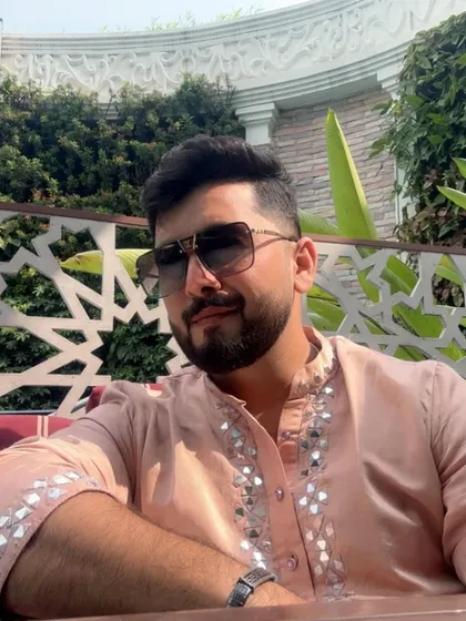 A relaxed moment in a beautiful mirror-work kurta. This is a great look for a Sangeet or Mehendi.