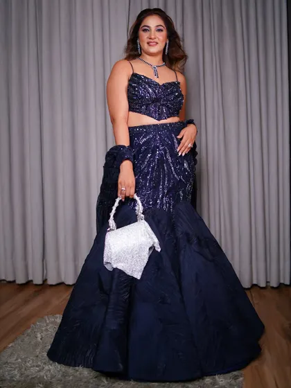 A confident pose in the full engagement outfit. The fishtail silhouette is a statement maker, perfect for a sister of the groom who wants to look special and celebratory.