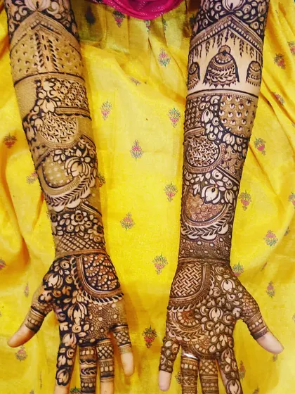 An intricate design featuring traditional architecture and dome motifs, giving the arms a majestic and regal look.