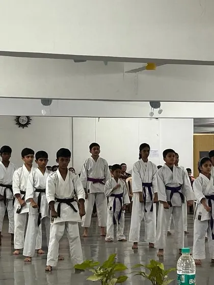 Students performing their Kata in unison for the examiners and parents. Group performance is a key part of our belt tests, emphasizing synchronization and spirit.