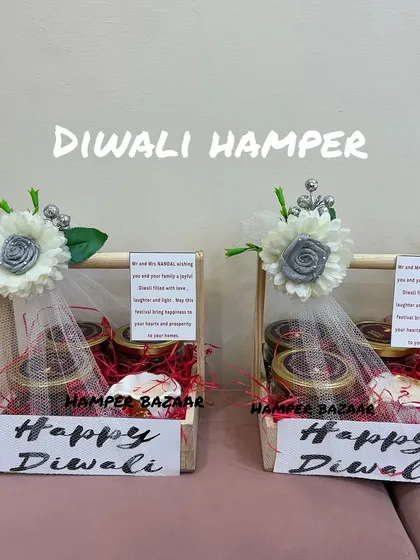 A simple yet elegant budget-friendly Diwali hamper. This pine wood basket contains three jars of treats like assorted chocolates and ragi chips, plus a premium candle, all for just ₹750.