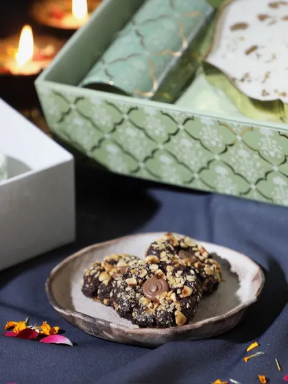 A shot of our festive hazelnut cookies, a popular addition to many of our custom Diwali hampers.